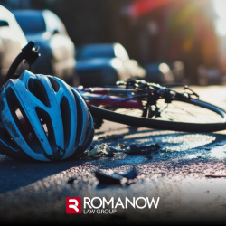A bicycle and helmet lay on the road after a collision with a car in Maine