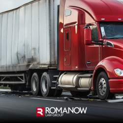 Red semi-truck with collision damage to its side after a Portland truck accident